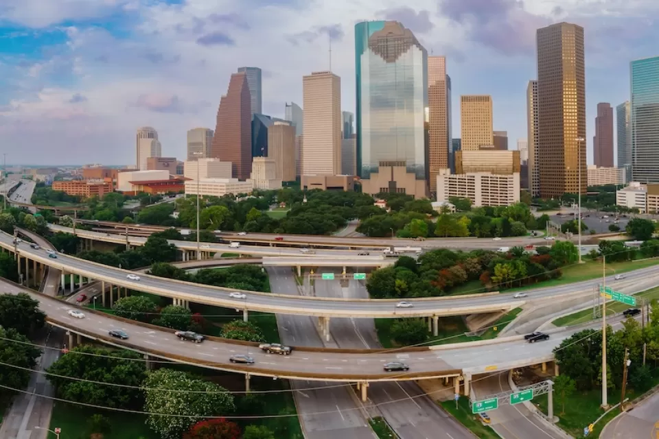 View of downtown Houston with elevated freeways in foreground.
